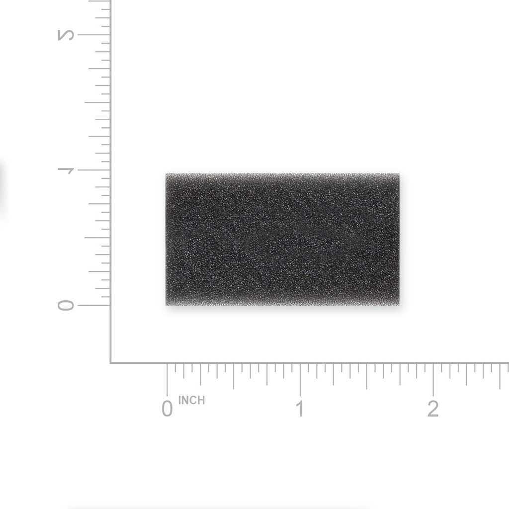 Rectangular black foam filter with measurement scale on a white background