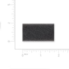 Rectangular black foam filter with measurement scale on a white background