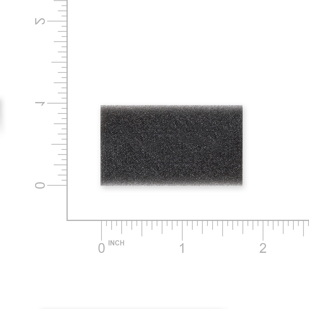 Rectangular black foam filter with measurement scale on a white background