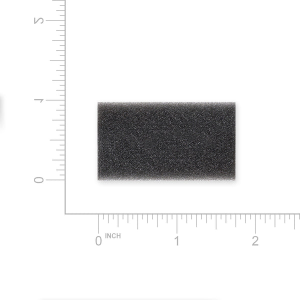 Rectangular black foam filter with measurement scale on a white background