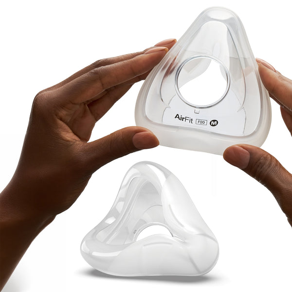 AirFit P10 mask held by hands on a white background