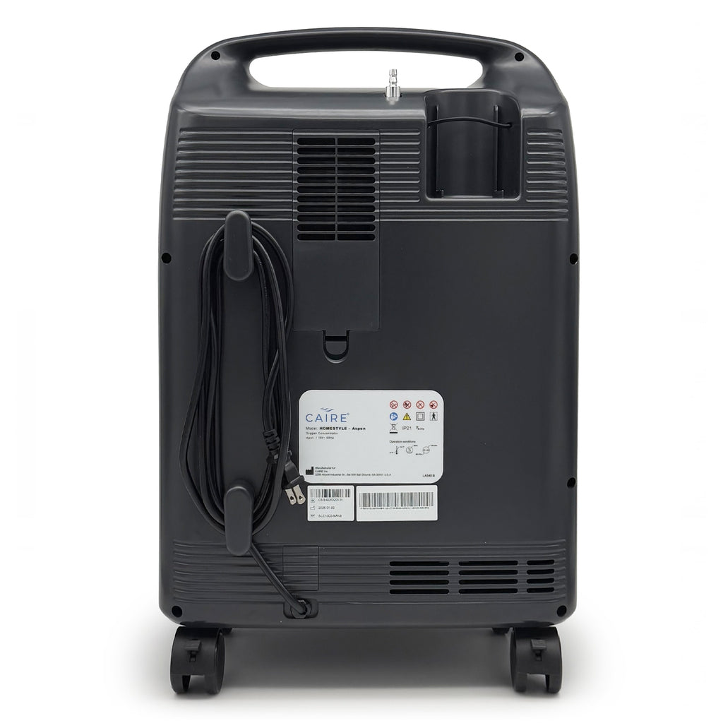 Back view of a black portable oxygen concentrator with visible branding on a white background