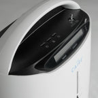 Close-up of a Caire oxygen concentrator with control panel and brand name.