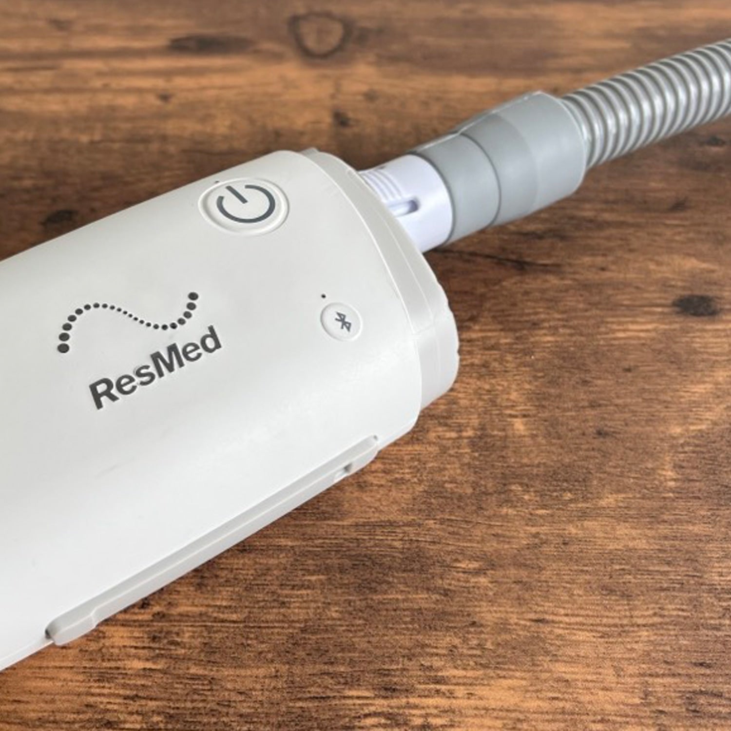 ResMed CPAP on a wooden surface