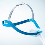Blue and silver headgear on a light blue background