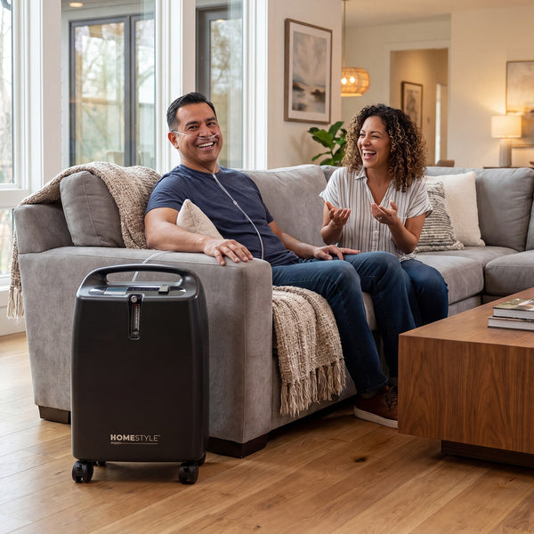 Man using an oxygen concentrator next to a woman in a living room setting