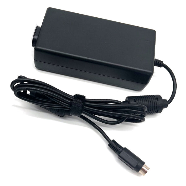 A black rectangular power adapter with a coiled black cable secured by a black elastic band, photographed on a plain white background.