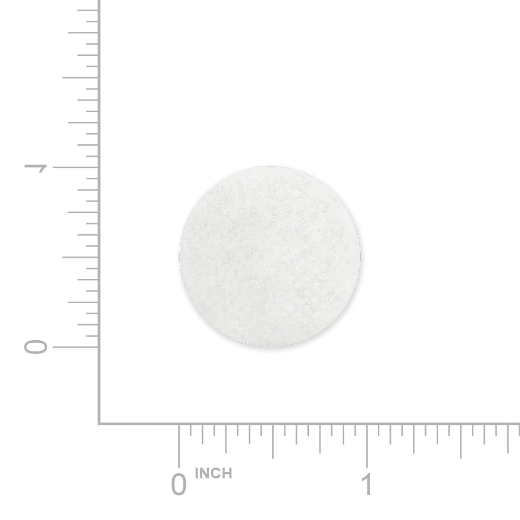 White round luna travel CPAP filter with a ruler for scale on a white background