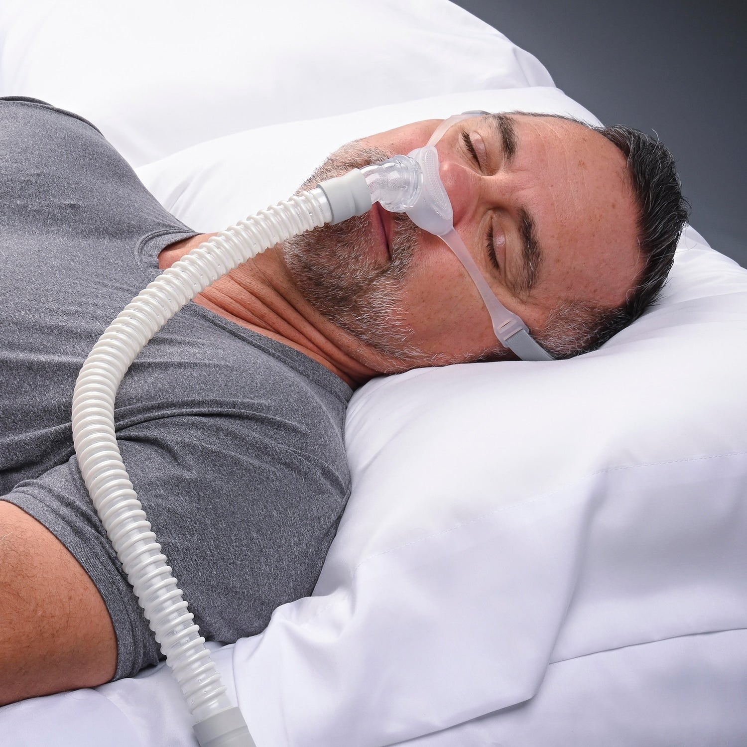 Man using a CPAP mask while sleeping