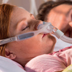women wearing philips respironics nuance  pro gel nasal pillow cpap mask while sleeping