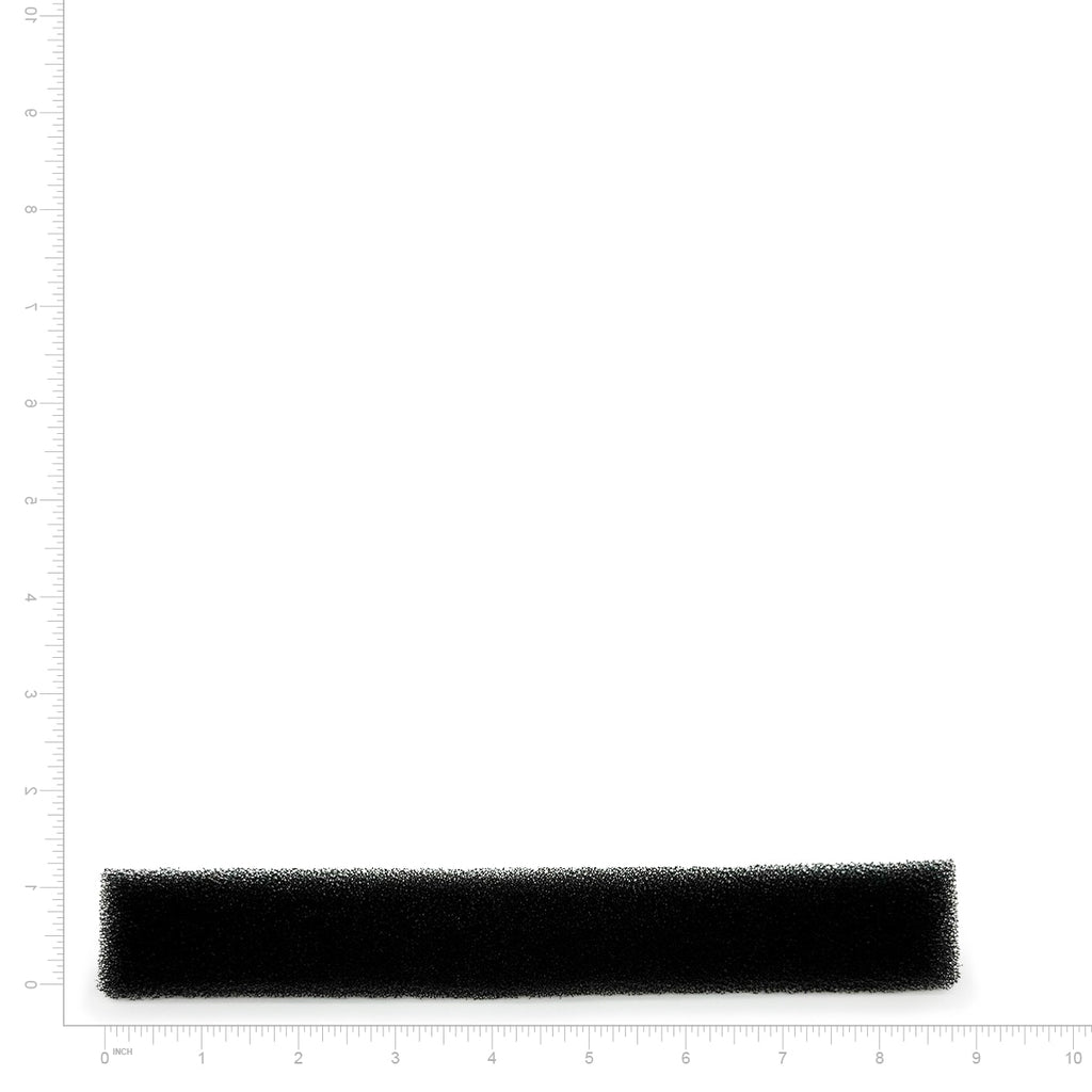 Rectangular black filter on a white background with measurement scale