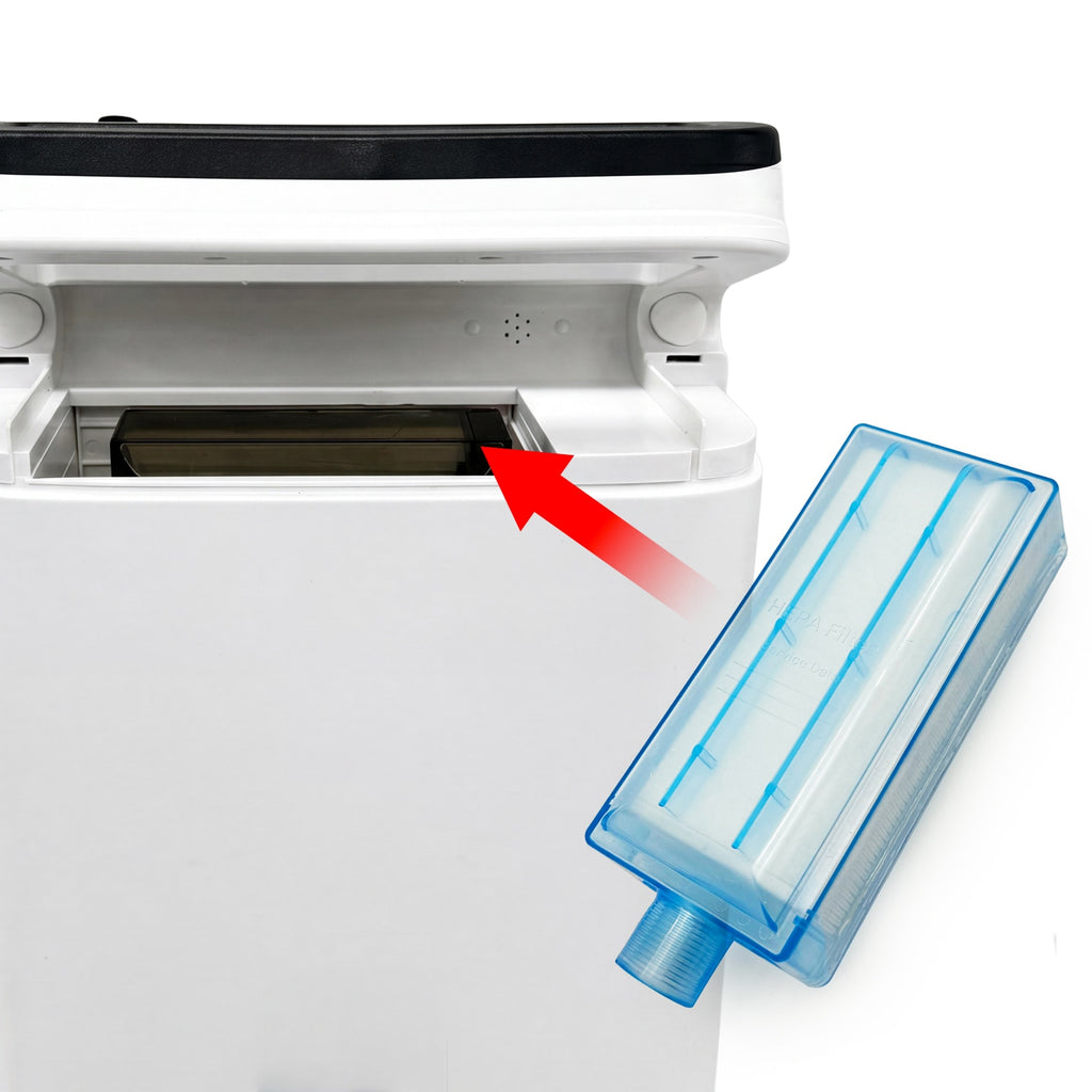 Blue air filter with a red arrow pointing towards an open oxygen concentrator