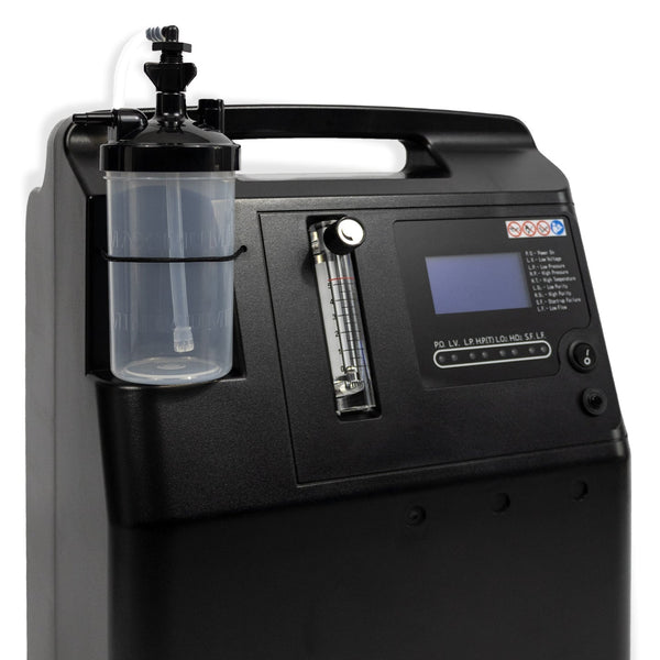 Black medical device with a clear container attached on a white background