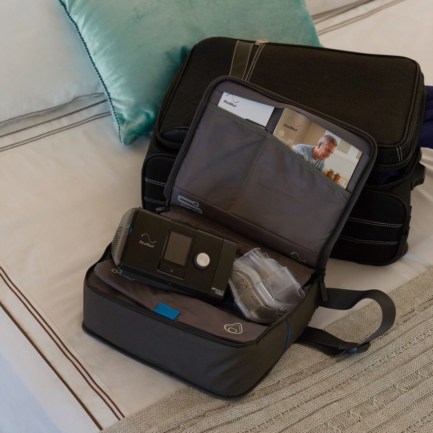 Airsense 10 travel bag open on bed