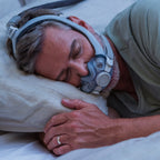 Woman sleeping on her side wearing Resmed AirTouch F30i COMFORT CPAP Mask
