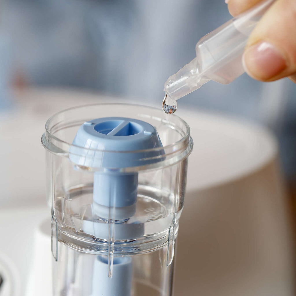 sidestream nebulizer cup being filled with medication