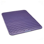 Purple silicone mat with textured surface on a light purple background