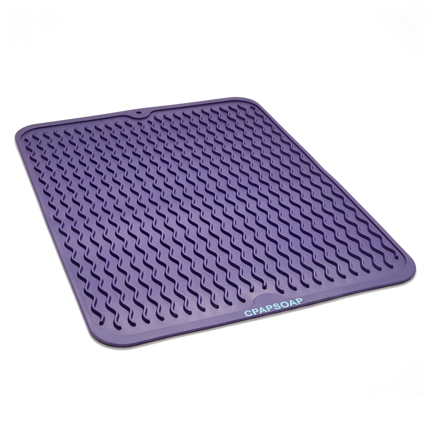 Purple silicone mat with textured surface on a light purple background