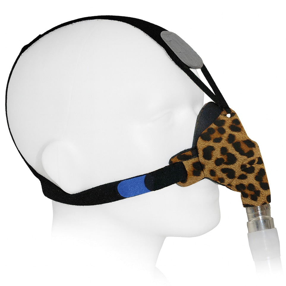  leopard print cpap mask  on a mannequin head against a white background