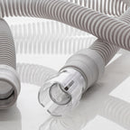 Close-up of a medical device hose on a reflective surface