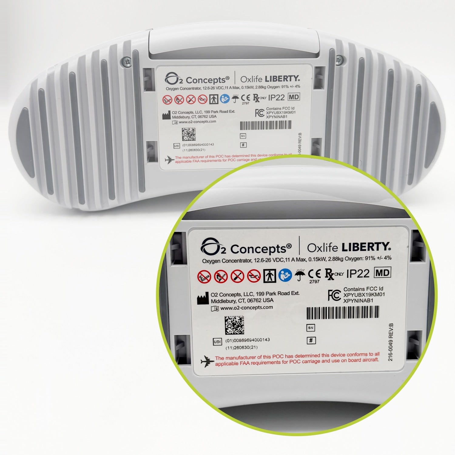 A white ribbed cylindrical device shown from the back with a circular inset zooming in at the bottom right on the printed label. The label reads O2 Concepts | Oxify LIBERTY' and includes regulatory marks and barcodes.