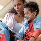 tucker face back for nebulizing with mom